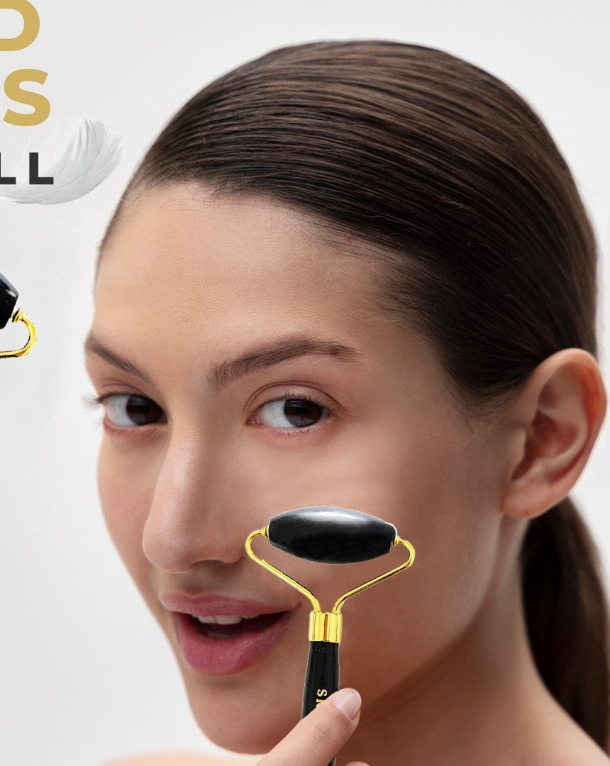 The dual-sided bian stone roller used along the cheek