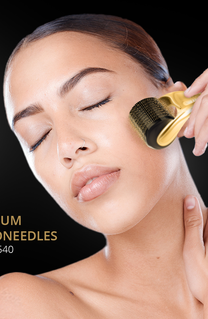 The gold 1.5 mm roller held against the cheek